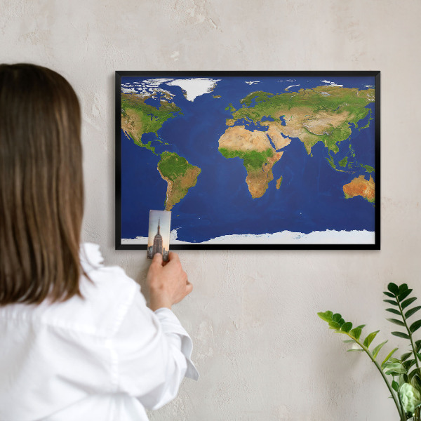 Vacation magnet board with a black frame Mapping the globe