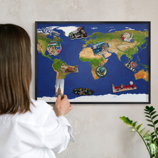 Vacation magnet board with a black frame Mapping the globe