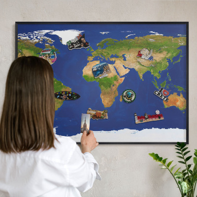 Vacation magnet board with a black frame Mapping the globe