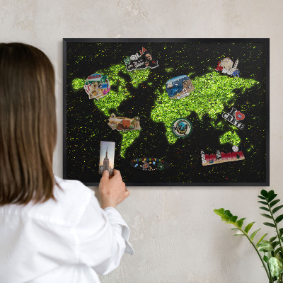 Metal wall board for magnets in a black frame Green map