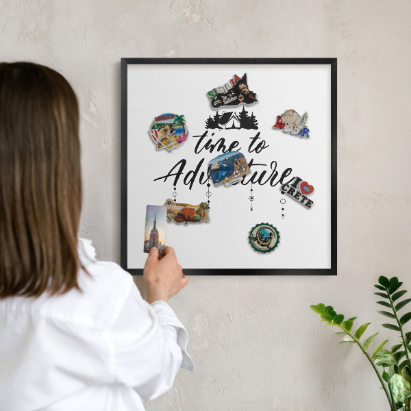 Metal wall board for magnets in a black frame Adventure awaits