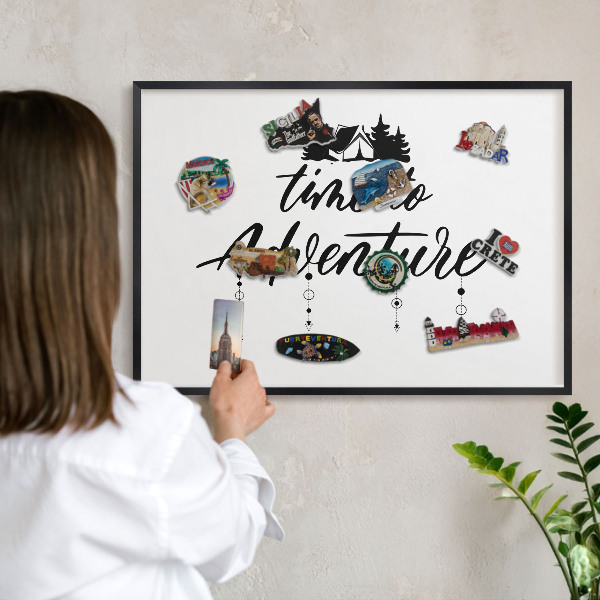 Metal wall board for magnets in a black frame Adventure awaits