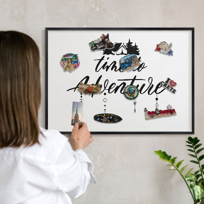 Metal wall board for magnets in a black frame Adventure awaits
