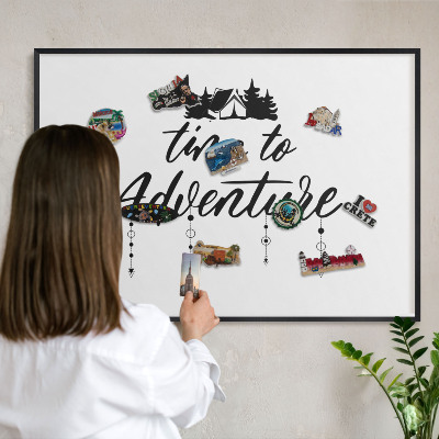 Metal wall board for magnets in a black frame Adventure awaits