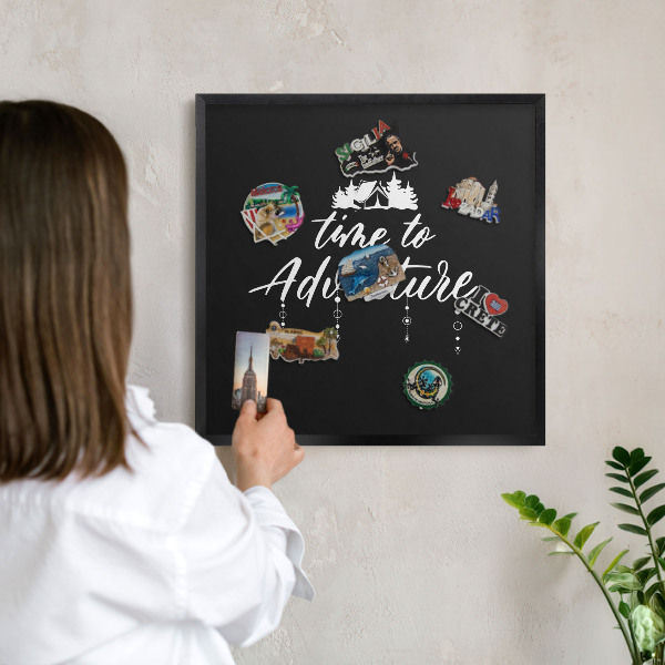 Vacation magnet board with a black frame Adventure awaits