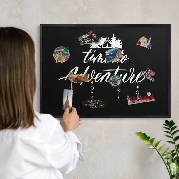 Vacation magnet board with a black frame Adventure awaits