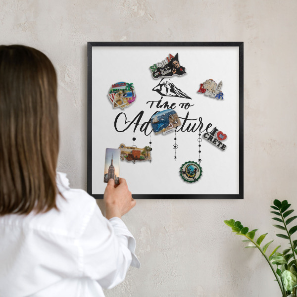 Metal wall board for magnets in a black frame Mountain adventure