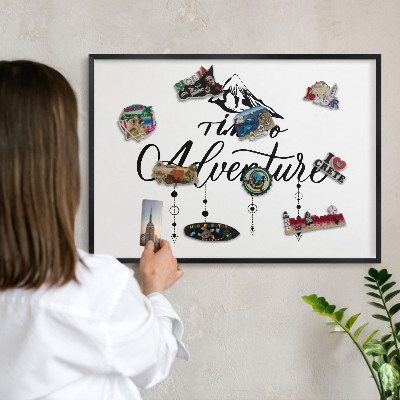 Metal wall board for magnets in a black frame Mountain adventure