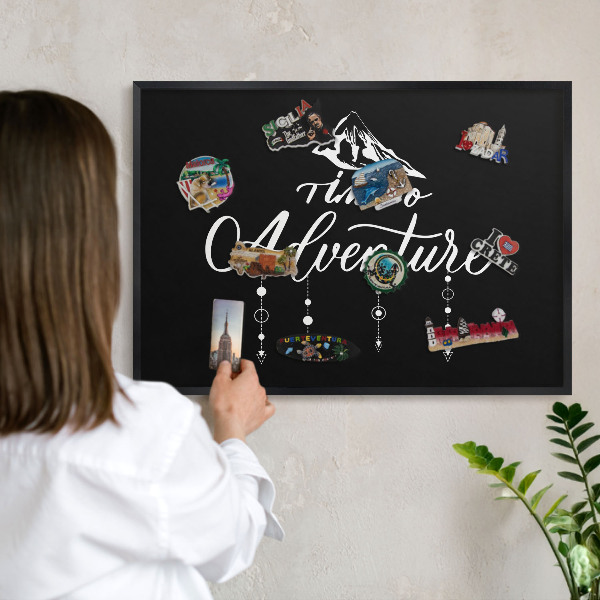 Vacation magnet board with a black frame Adventure awaits