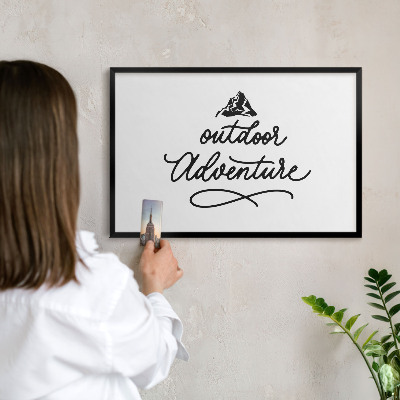 Metal wall board for magnets in a black frame Mountain adventure