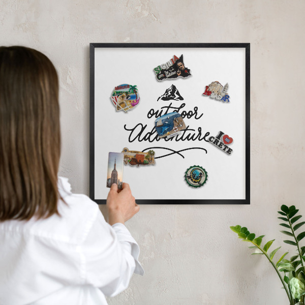 Metal wall board for magnets in a black frame Mountain adventure