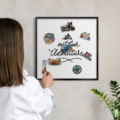 Metal wall board for magnets in a black frame Mountain adventure