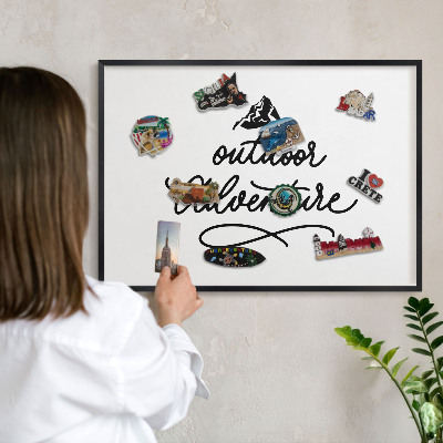 Metal wall board for magnets in a black frame Mountain adventure