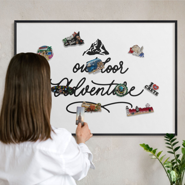Metal wall board for magnets in a black frame Mountain adventure