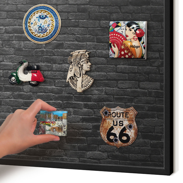 Metal wall board for magnets in a black frame Brick wall