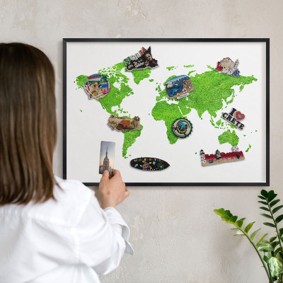 Metal wall board for magnets in a black frame Green map