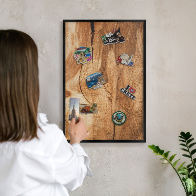 Metal wall board for magnets in a black frame Natural wood