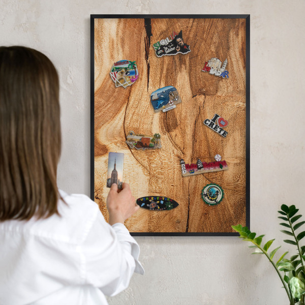 Metal wall board for magnets in a black frame Natural wood