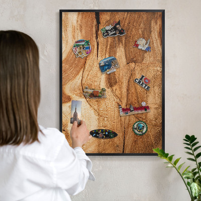 Metal wall board for magnets in a black frame Natural wood