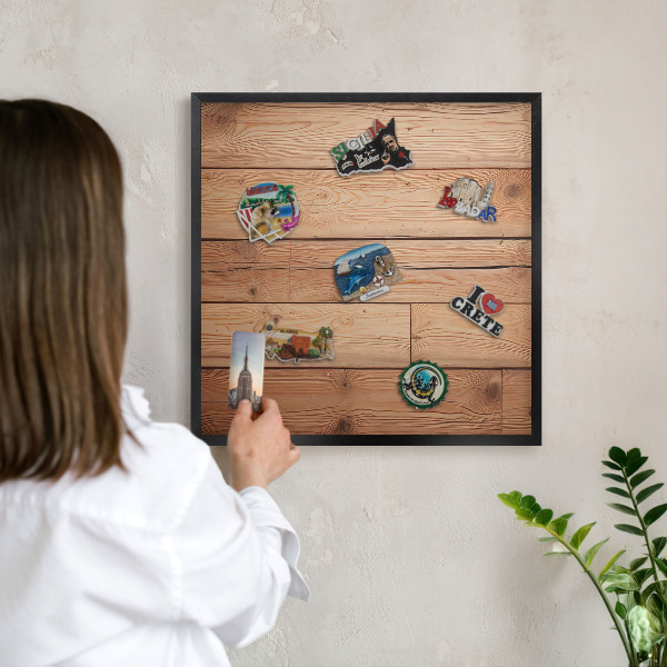 Metal wall board for magnets in a black frame Wooden boards