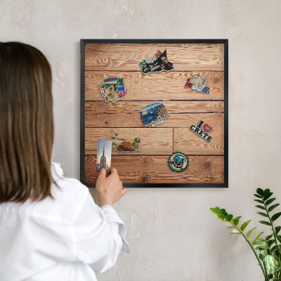 Metal wall board for magnets in a black frame Wooden boards