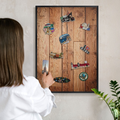 Metal wall board for magnets in a black frame Wooden boards