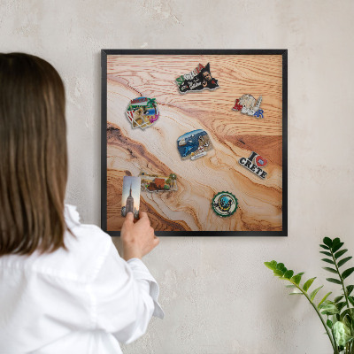 Metal wall board for magnets in a black frame Wooden texture