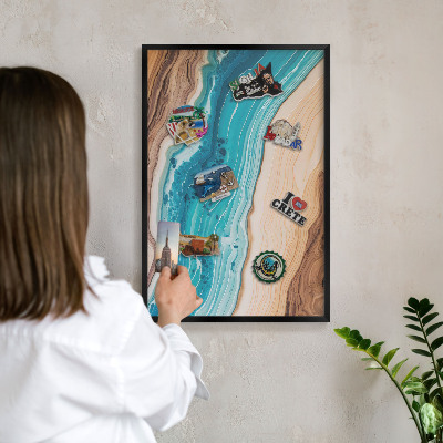 Metal wall board for magnets in a black frame Earth's layers