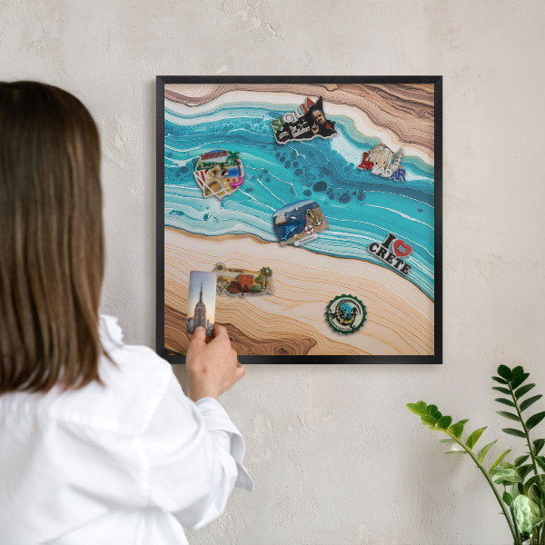 Metal wall board for magnets in a black frame Earth's layers