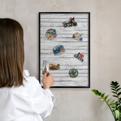 Metal wall board for magnets in a black frame Light wood