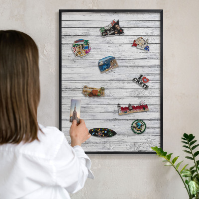 Metal wall board for magnets in a black frame Light wood