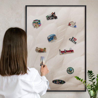Metal wall board for magnets in a black frame Cream feathers