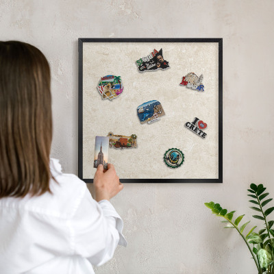 Metal wall board for magnets in a black frame Creamy elegance