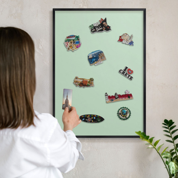 Vacation magnet board with a black frame Mint green