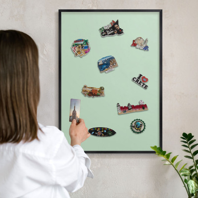 Vacation magnet board with a black frame Mint green