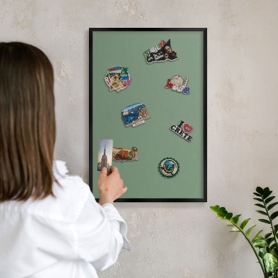 Vacation magnet board with a black frame Muted green