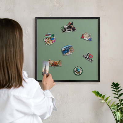 Vacation magnet board with a black frame Muted green
