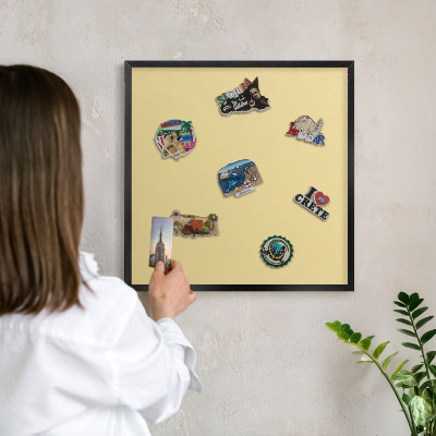 Metal wall board for magnets in a black frame Creamy yellow