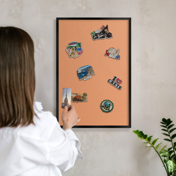 Vacation magnet board with a black frame Pastel orange
