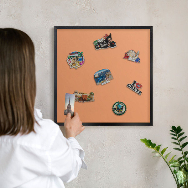 Vacation magnet board with a black frame Pastel orange
