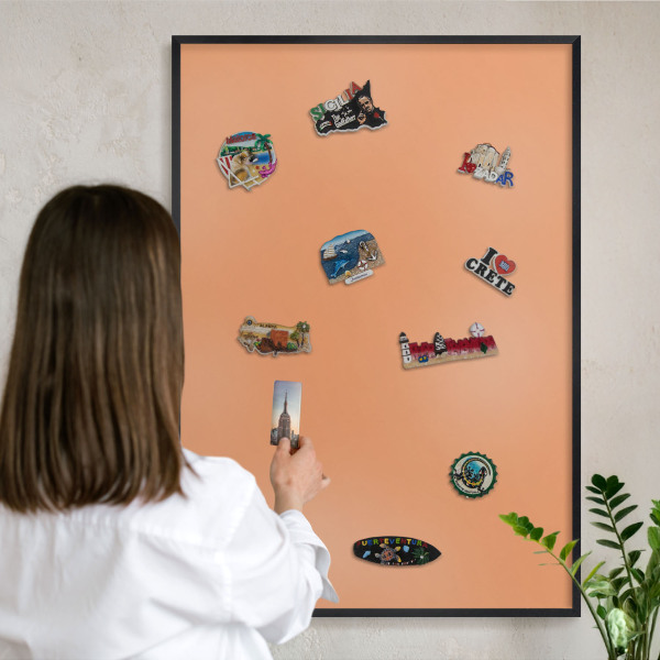 Vacation magnet board with a black frame Pastel orange