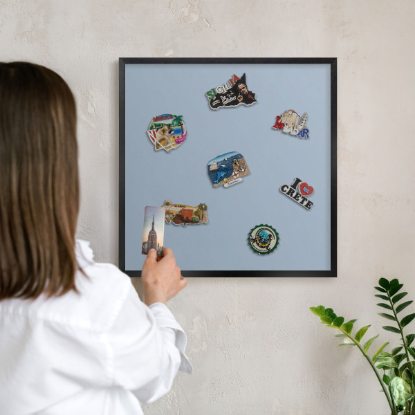 Vacation magnet board with a black frame Pastel blue