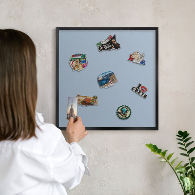Vacation magnet board with a black frame Pastel blue