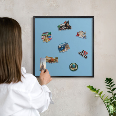 Vacation magnet board with a black frame Blue color