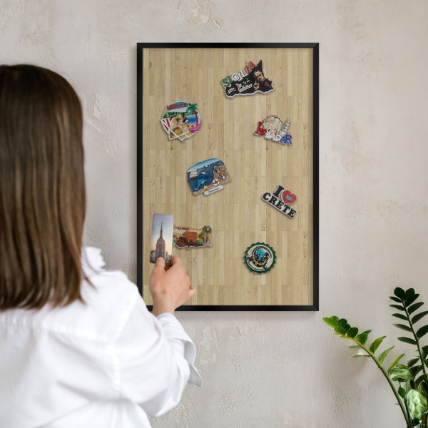 Metal wall board for magnets in a black frame Wooden texture