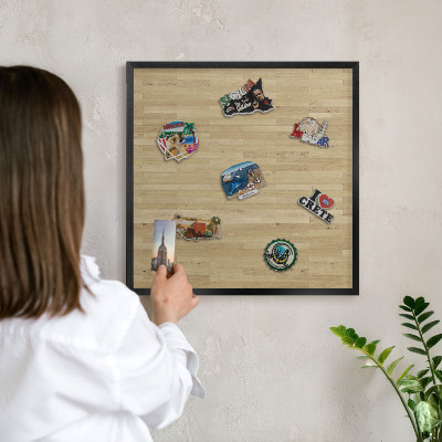 Metal wall board for magnets in a black frame Wooden texture