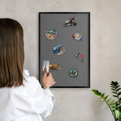 Metal wall board for magnets in a black frame Gray texture