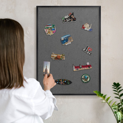 Metal wall board for magnets in a black frame Gray texture