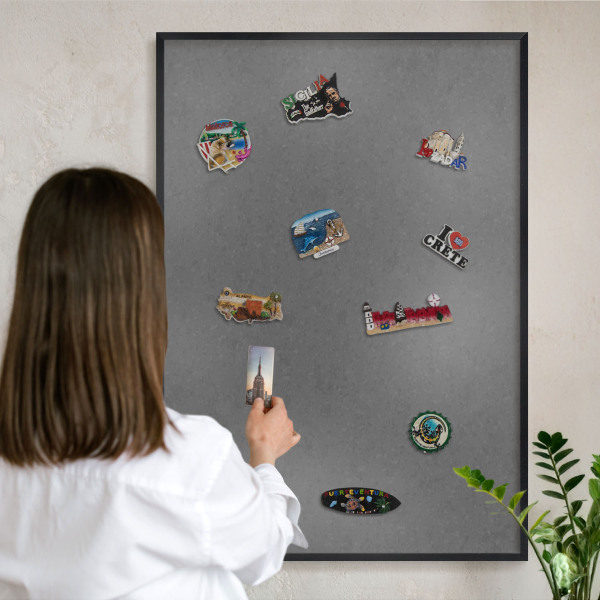 Metal wall board for magnets in a black frame Gray texture