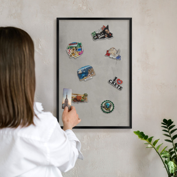 Vacation magnet board with a black frame Gray background